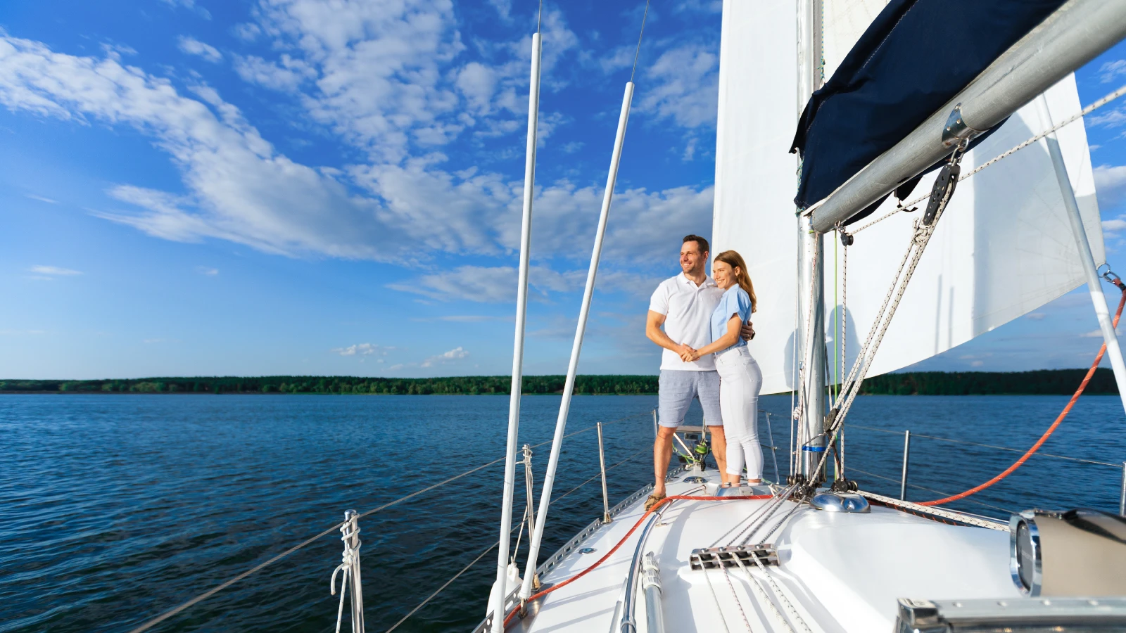 fairfield loving couple standing on yacht enjoying romantic img.webp